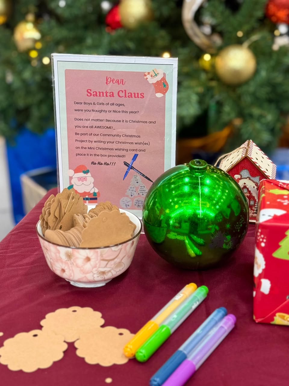 A festive display at Pasir Ris Elias Community Club, inviting participation in the Christmas wish project.