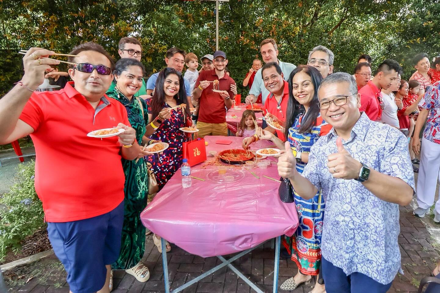 A diverse group of people smiling and interacting, symbolizing racial harmony.
